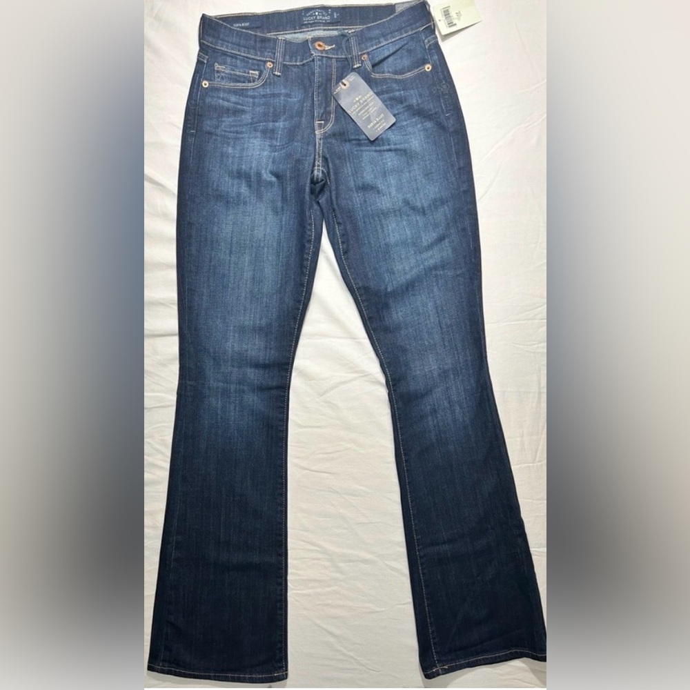 Lucky Brand women’s Sofia boot
mid rise jeans size 4/27 Long